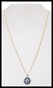 A hallmarked  9ct gold sapphire and diamond pendant necklace. Import mark for Birmingham. Weight 5.