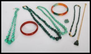 A group of malachite / jade type jewellery to include bead necklaces, heart pendant, Buddha pendant,