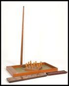 A vintage large mid century bar skittles game complete with skittles, table, scoring board, arm