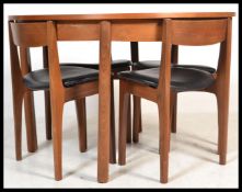 A vintage retro 20th century Nathan Caspian range teak circular extending dining table and chairs.