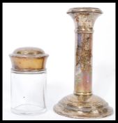 A hallmarked silver lidded glass dressing / desk table pot hallmarked for Birmingham 1912 along with