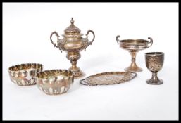 A group of silver hallmarked miniatures and dolls house furniture to include hallmarked goblet,