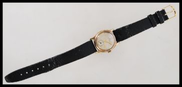 A 9ct gold vintage Rolex Precision watch having a silvered dial with gilt baton and Arabic