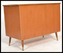 A vintage retro 20th century teak wood blanket box storage chest raised on retro tapering legs
