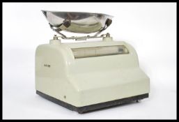 A set of vintage retro 20th century Avery weighing grocers scales having a lime enamel finish with