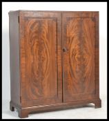 A 19th century Maple & Co mahogany inlaid two door cabinet being raised on bracket feet with twin