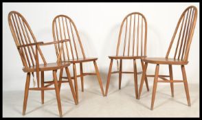 A set of four vintage 20th century Priory Ercol style Windsor chairs having spindle back rests.