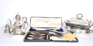 A collection of vintage silver plated items dating from the early 20th Century to include teapot,