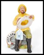 Two Royal Doulton ceramic figurines The Lobster Man HN2317 and The Boatman Skylark HN2147.