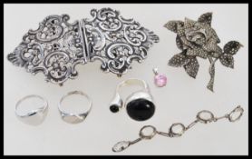 A collection of silver items to include a rococo twin ladies / nurses belt buckle, silver and