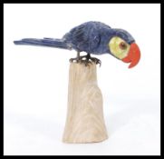 An early 20th century 1920's animal Tiffany style figurine of a parrot constructed from hard stone