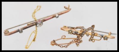 Three 9ct gold brooches one being a curb link solid brooch along with a seed pearl bar brooch and