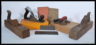 A collection of vintage 20th Century wood working planes to include box planes, a cased Stanley No 4