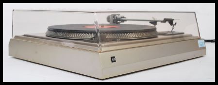 A Dual CS 505 - 1 belt drive record player, clear perspex lid to top, chrome affect housing.