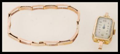 A hallmarked 9ct gold watch with 9ct gold folding watch bracelet, The silvered dial having faceted