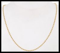 A 9k gold fine rope twist necklace chain having a bolt ring clasp. Weighs 10.9 grams.