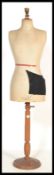 A vintage early 20th century French mannequin raised on an octagonal wooden base. Makers stamp E.G