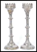 A large pair of early 20th century silver plated ecclesiastical candlesticks  raised on circular