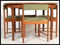 A vintage retro 20th century Mcintosh teak round table along with a set of four retro wedge