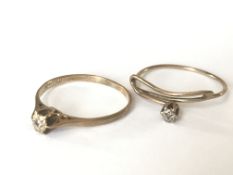 Two 9ct gold and diamond rings both having central illusion set diamonds. Marks worn tests 9ct gold.