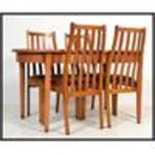 A vintage retro 20th century teak dining suite of Danish influence consisting of oval extending