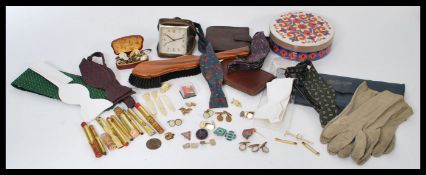 A good group of gents silk and other bow ties along with a quantity of cufflinks. Please see