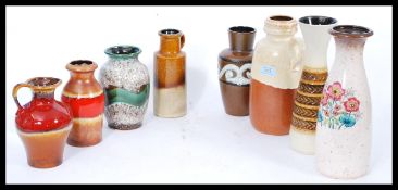 A collection of vintage retro mid 20th century West German pottery to include vases and jugs, fat