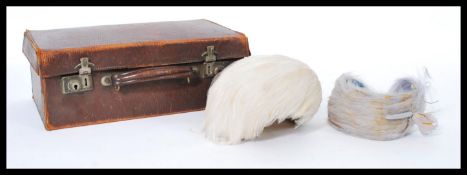 Two vintage mid 20th century 1950's feather hats one of hair band type both having died colouring.