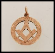 A 9ct gold Chester hallmarked necklace pendant of Masonic interest. Hallmarked to verso with bale