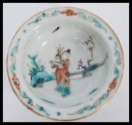 A 19th century Chinese finger bowl having a Famille verte decoration with hand painted scene of a
