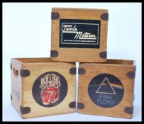 A group of three vintage style 45rpm record storage wooden boxes being metal bound to include