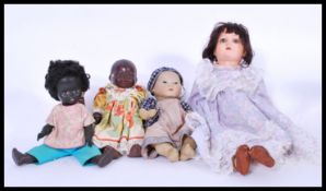 A collection of four vintage 20th Century dolls to include Armand Marseille Chinese bisque headed
