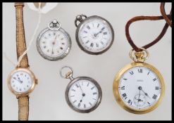 A collection of watches to include a 3 silver vintage fob watches, a yellow metal vintage wristwatch