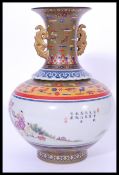 A large 19th century Chinese baluster vase having a hand painted globular body with scenes of
