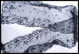 A vintage early 20th century Sicilian mourning lace shawl / scarf having hand embroidered patterns