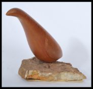 A vintage early 20th century North American carving of a bird. Hand carved from a single piece of