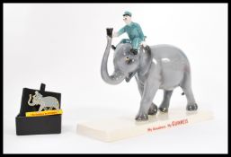 A Coalport ceramic Guinness advertising figurine Elephant and Keeper. Limited Edition 333/800.