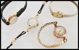 A hallmarked 9ct gold cocktail watch along with some other vintage cocktail watches. Please see