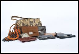 A collection of ladies vintage purses dating from the first half of the 20th Century to include