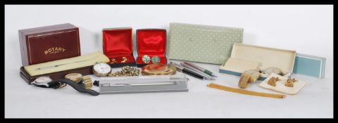 A group of vintage watches cufflinks and pens to include a continental silver pocket watch,