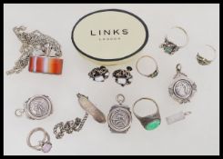 A group of sterling silver jewellery to include ingot pendants, banded agate pendant, silver