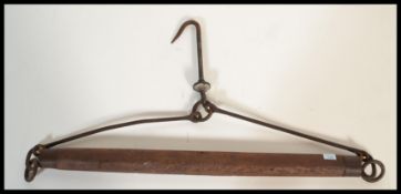 A late 19th Century Victorian wooden and cast iron horse cart / carriage linkage together with
