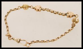 A Victorian 19th century 9ct gold bracelet with shaped mesh links applied with decorative ball and