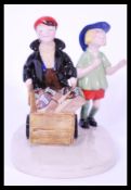 A Royal Doulton Advertising Bisto For Gravy ceramic figurine group entitled The Bisto Kids MCL4