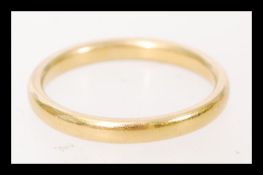 A hallmarked 22ct gold wedding band ring. Weighs 3.6 grams.