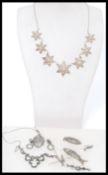 A group of vintage silver filigree and marcasite jewellery to include filigree flower star necklace,