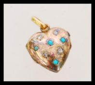 An early 20th century 9ct gold turquoise and rose cut diamond set heart locket pendant. Marked 9ct