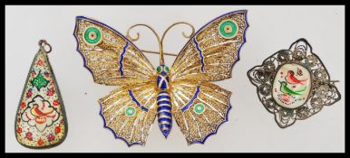 A stunning early 20th century Art Nouveau gilt metal and enamel butterfly brooch with pin verso