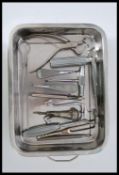 A collection of 20th century surgeons tools of stainless steel construction. To include tray and