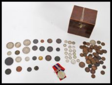 A collection of coins dating from the 17th Century to include a James II Irish Civil War Gunmoney